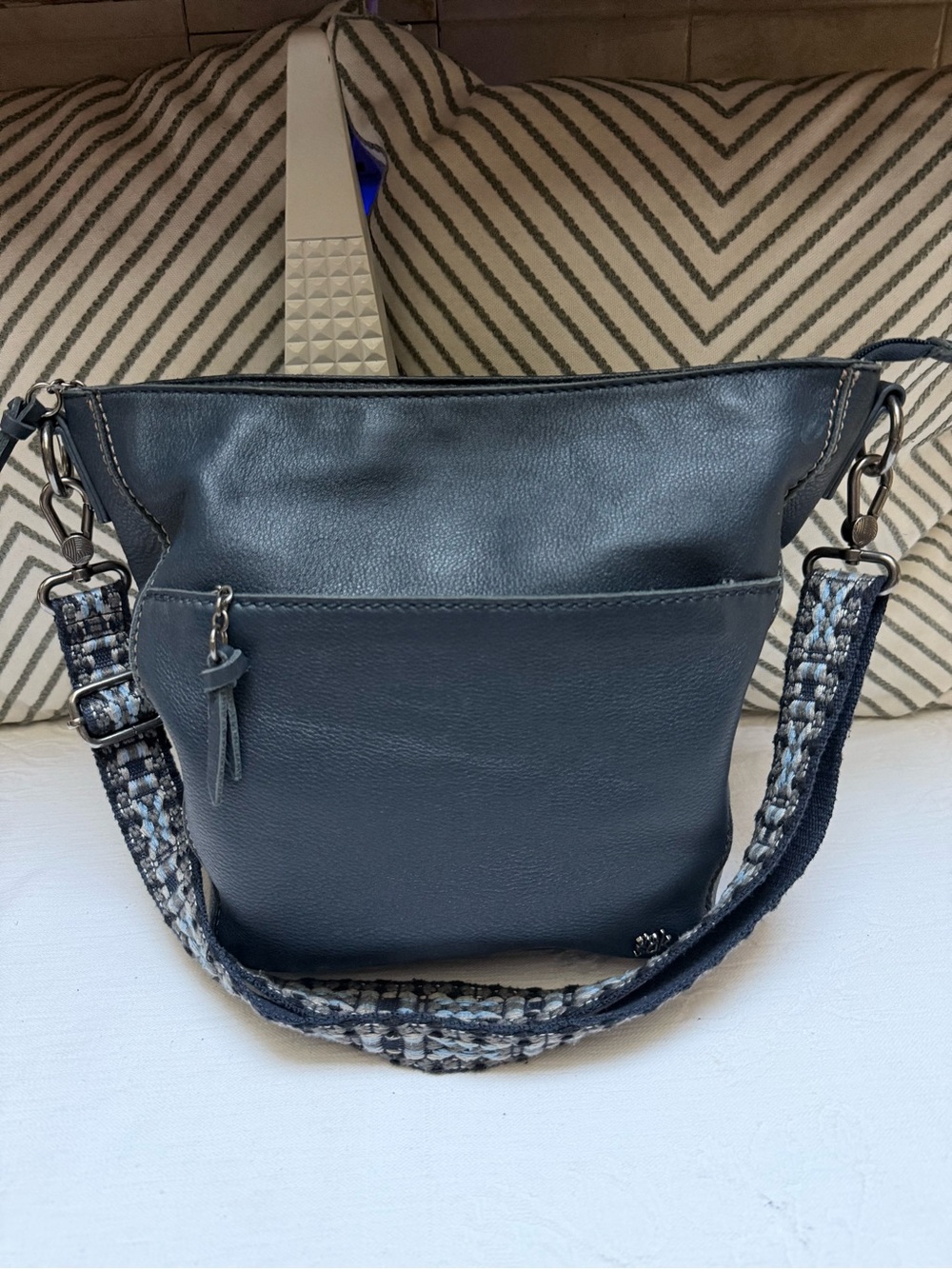 The Sak Navy Blue Leather Crossbody Bag with Guitar-Like Adjustable Strap